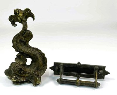 Lot 143 - A 20th century brass dolphin door stop, height...