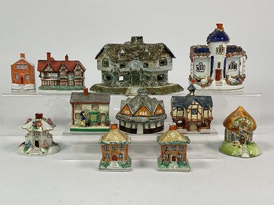 Lot 265 - A quantity of Staffordshire pottery buildings,...