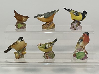 Lot 296 - ROYAL WORCESTER; six porcelain bird models,...