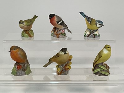 Lot 297 - ROYAL WORCESTER; six porcelain bird models,...