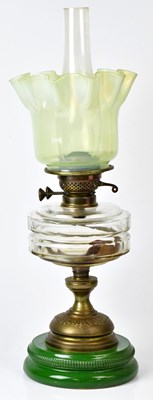Lot 120 - A Victorian-style oil lamp with green Vaseline...