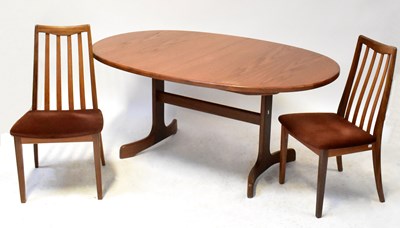 Lot 5 - G-PLAN; an extending teak dining table with...