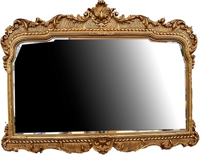 Lot 102 - A Rococo-style gilt wall mirror of shaped...