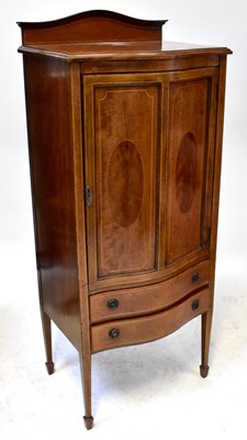 Lot 56 - A Sheraton-style bow-fronted cabinet, with...