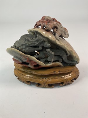 Lot 105 - A soapstone carving of a dragon and young,...