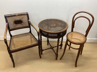 Lot 675 - DRUCE & CO; a stained beech and cane chair by...