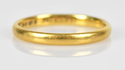 Lot 453 - A 22ct yellow gold wedding band, size P,...