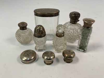 Lot 509 - THORNHILL & CO; a oval glass bottle having a...