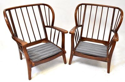 Lot 36 - ERCOL; an elm and beech mid-colour three-piece...