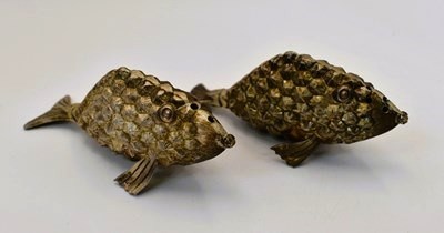 Lot 467 - A sterling silver two piece cruet in the form...