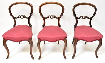 Lot 35 - A set of six Victorian walnut balloon-back...