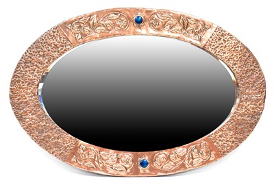 Lot 106 - An Arts and Crafts copper framed oval wall...