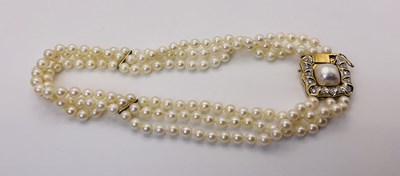 Lot 519 - An elegant 18ct gold, diamond and triple...