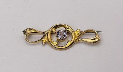 Lot 562 - An antique 9ct gold brooch with a centrally...