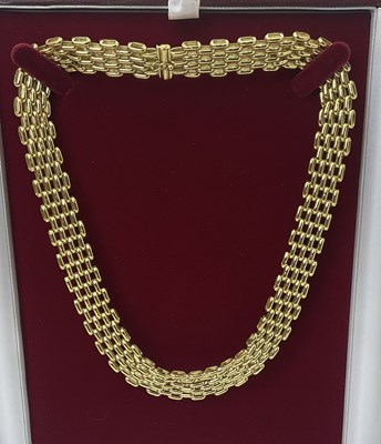 Lot 525 - An 18ct yellow gold interlocking bar link...