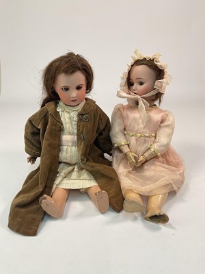 Lot 56 - Two 19th century bisque headed dolls,...