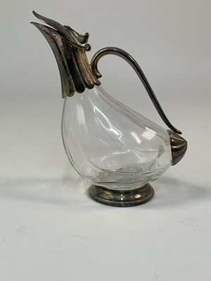 Lot 334 - CARAFFA A 'CANARD'; a glass and silver plated...