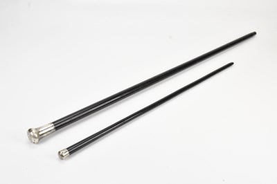 Lot 2055 - A hallmarked silver topped ebonised walking...
