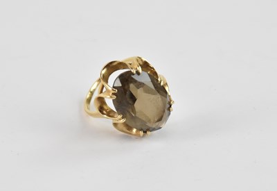 Lot 885 - A 9ct yellow gold ring, with a smokey quartz...