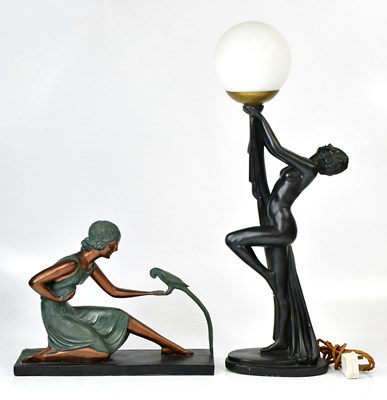 Lot 123 - An Art Deco style lamp with a nude lady...