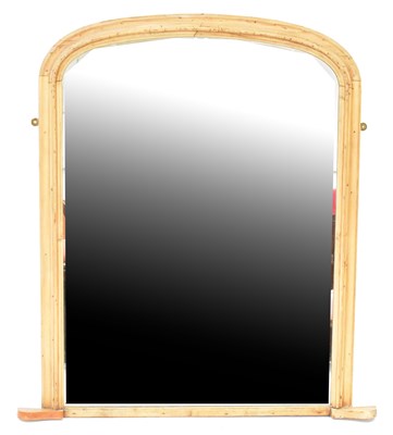 Lot 103 - A pine framed arched top mantel mirror, 108 x...