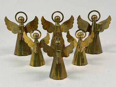 Lot 154 - Six brass angel candleholders, height 17.5cm.