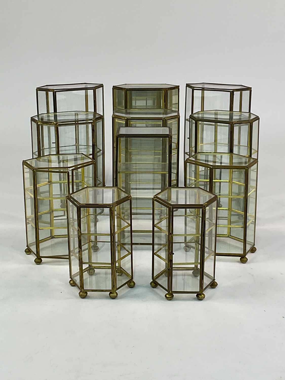 Lot 25 - A quantity of brass and glass miniature...