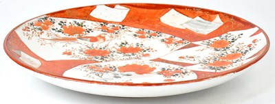Lot 226 - A Japanese Kutani charger, painted with panels...