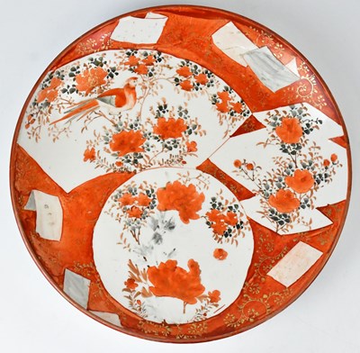 Lot 226 - A Japanese Kutani charger, painted with panels...