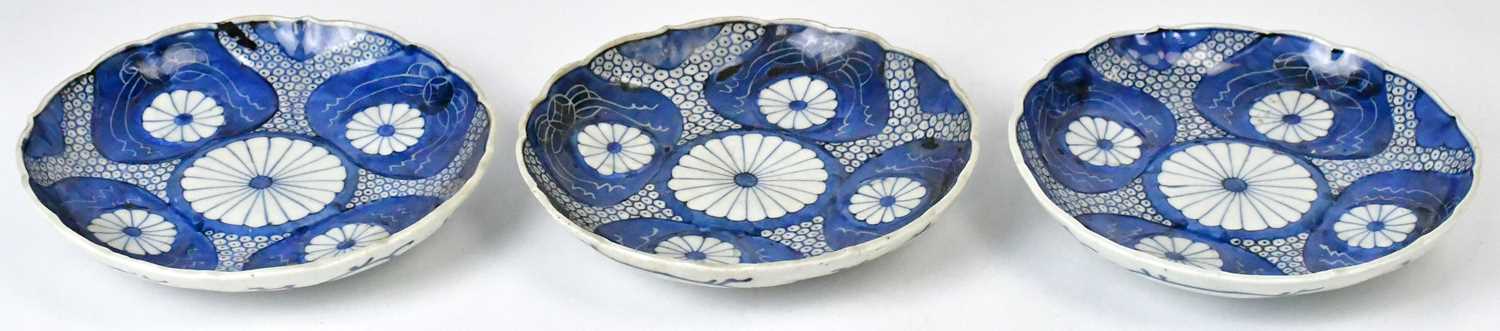 Lot 224 - Three Japanese Meiji period Imari plates, with...