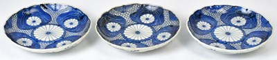 Lot 224 - Three Japanese Meiji period Imari plates, with...
