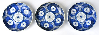 Lot 224 - Three Japanese Meiji period Imari plates, with...