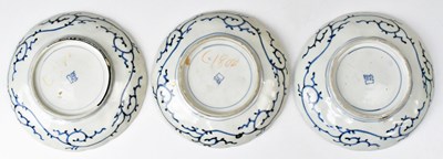 Lot 224 - Three Japanese Meiji period Imari plates, with...