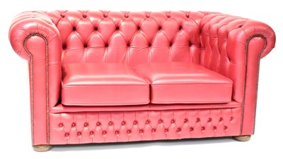 Lot 44 - A modern Chesterfield red leather two-seater...