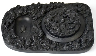 Lot 241 - A Chinese black ink stone, the mo-tang relief...