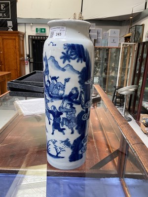 Lot 245 - A blue and white cylindrical vase painted with...