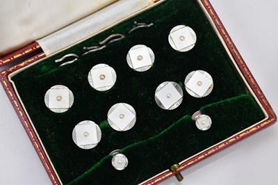 Lot 153 - A 9ct white gold and seed pearl shirt studs...