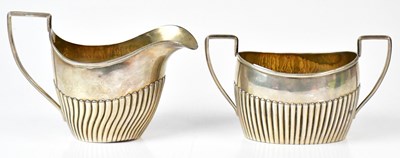 Lot 554 - NATHAN & HAYES; a Victorian silver milk jug...