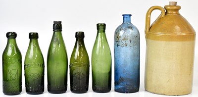 Lot 319 - A collection of thirteen vintage glass bottles,...