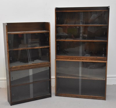 Lot 1219 - Four bookcases with sliding glass fronts