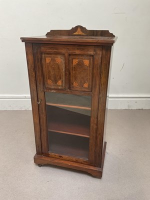 Lot 1259 - An Edwardian inlaid rosewood music cabinet,...