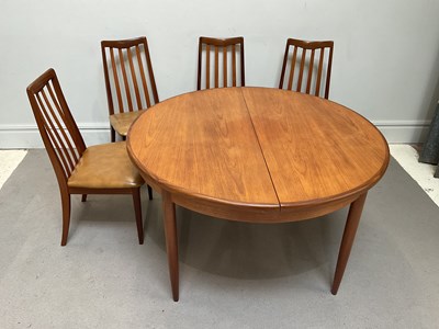 Lot 1019 - G PLAN; a teak circular extending dining table,...