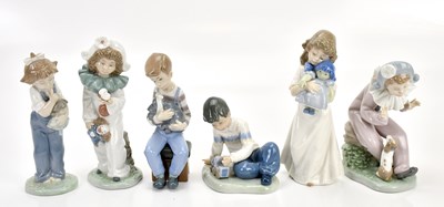Lot 1479 - NAO; a collection of figures comprising a boy...