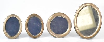 Lot 543 - Four silver photograph frames, comprising a...