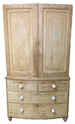Lot 654 - A 19th century pine bowfronted cupboard over...