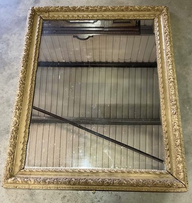 Lot 695 - A large ornately carved pine wall mirror, 114...