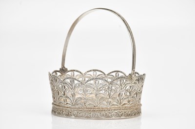 Lot 110 - A decorative white metal filigree basket with...