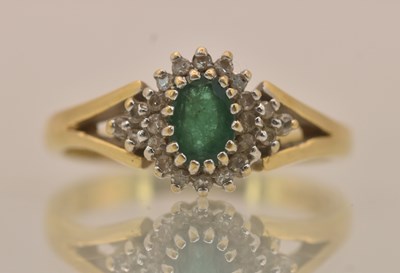 Lot 1324 - An 18ct yellow gold dress ring, with central...