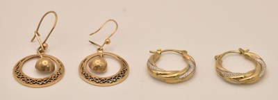 Lot 1388 - Two pairs of 9ct gold hoop style earrings, one...