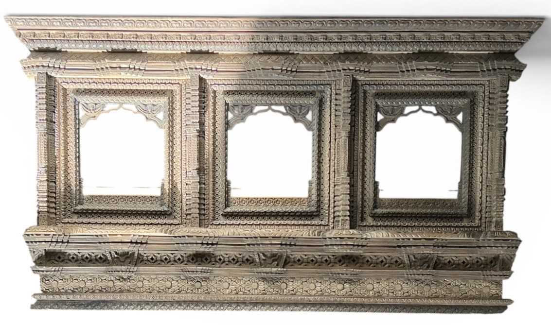 Lot 8 - An Indian jharokha profusely carved wooden...